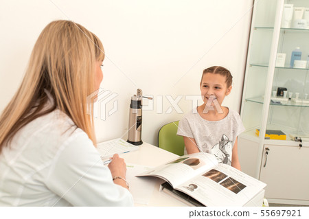 doctor trichologist conducts consultation with a doctor trichologist conducts consultation with a 55697921