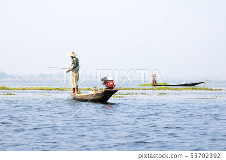 Fishermen swing fishing nets in Inle Lake, Inle, Fishermen swing fishing nets in Inle Lake, Inle, 55702392