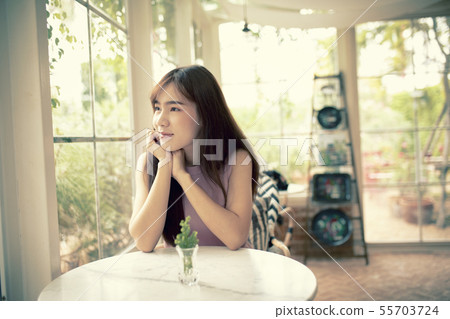 face of beautiful asian younger woman smiling with face of beautiful asian younger woman smiling with 55703724
