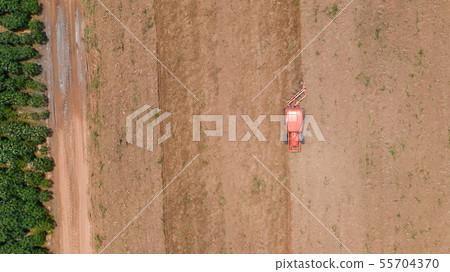 Top view of agricultural tractor vehicles working Top view of agricultural tractor vehicles working 55704370
