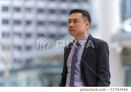 Asian Businessman standing with business office 55704466