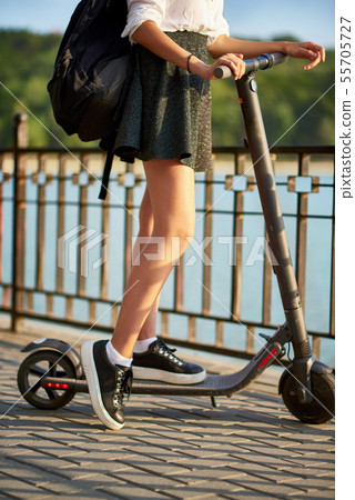 Teen high school girl with electric scooter near Teen high school girl with electric scooter near 55705727