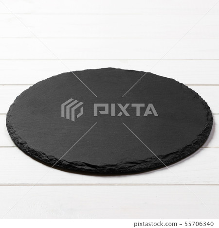 Black round plate on wooden background, top view, Black round plate on wooden background, top view, 55706340