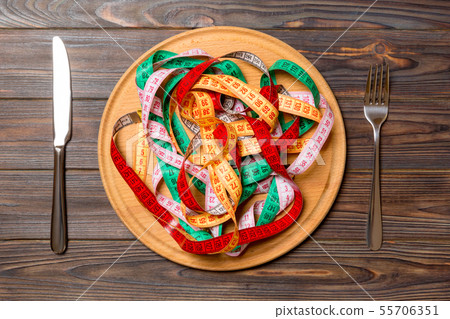 Heap of colorful measuring tape instead of 55706351