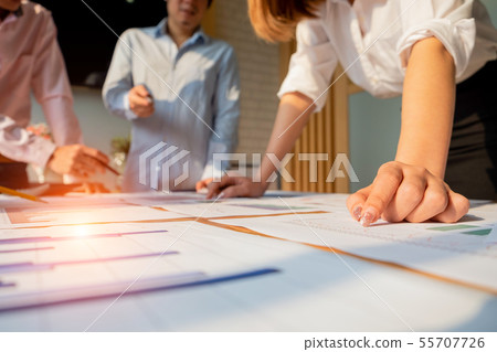 Businesspeople analyzing investment graph meeting Businesspeople analyzing investment graph meeting 55707726