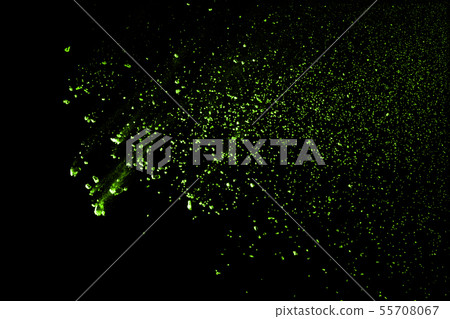 Explosive powder green on black background. 55708067
