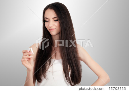 happy young beautiful woman holding a broken cigarette,quit smoking concept 55708533