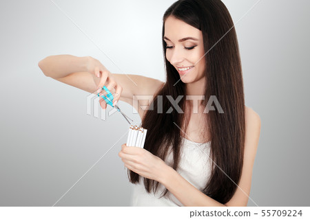 Beautiful Woman Quitting Smoking Cigarettes. Stop Smoking Beautiful Woman Quitting Smoking Cigarettes. Stop Smoking 55709224