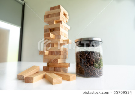 Wood block tower with architecture model concept Wood block tower with architecture model concept 55709554