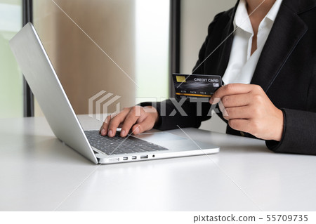 Business woman consumer holding credit card Business woman consumer holding credit card 55709735