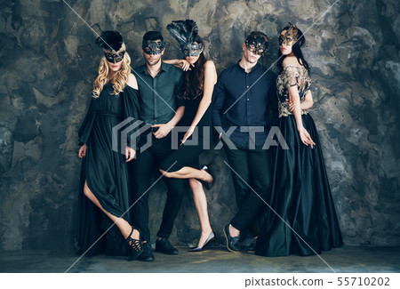 Group of people in masquerade carnival mask posing in studio Group of people in masquerade carnival mask posing in studio 55710202