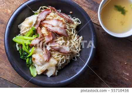 Traditional Thai egg noodles on wooden table top Traditional Thai egg noodles on wooden table top 55710436