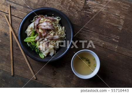 Traditional Thai egg noodles on wooden table top 55710443
