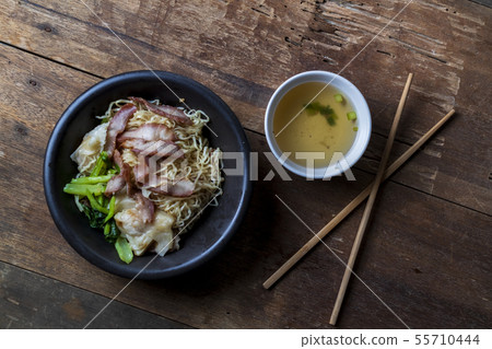Traditional Thai egg noodles on wooden table top Traditional Thai egg noodles on wooden table top 55710444