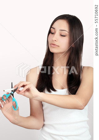 Quit Smoking. Closeup Of Beautiful Happy Female Breaking Cigarette. Portrait Of Smiling Woman Quit Smoking. Closeup Of Beautiful Happy Female Breaking Cigarette. Portrait Of Smiling Woman 55710692