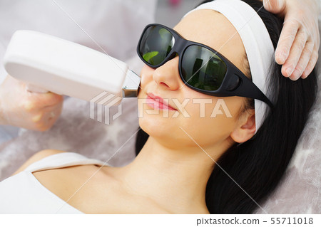 Cosmetology. Procedure of Microdermabrasion. Mechanical Exfoliation, diamond polishing. Model and Cosmetology. Procedure of Microdermabrasion. Mechanical Exfoliation, diamond polishing. Model and 55711018