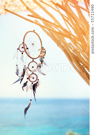 Dream catcher blown around by a light sea breeze Dream catcher blown around by a light sea breeze 55711490