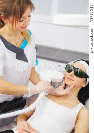 Cosmetology. Procedure of Microdermabrasion. Mechanical Exfoliation, diamond polishing. Model and Cosmetology. Procedure of Microdermabrasion. Mechanical Exfoliation, diamond polishing. Model and 55711512