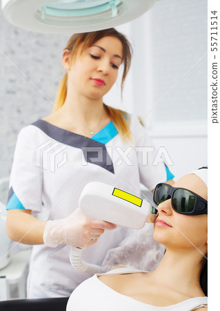 Cosmetology. Procedure of Microdermabrasion. Mechanical Exfoliation, diamond polishing. Model and Cosmetology. Procedure of Microdermabrasion. Mechanical Exfoliation, diamond polishing. Model and 55711514