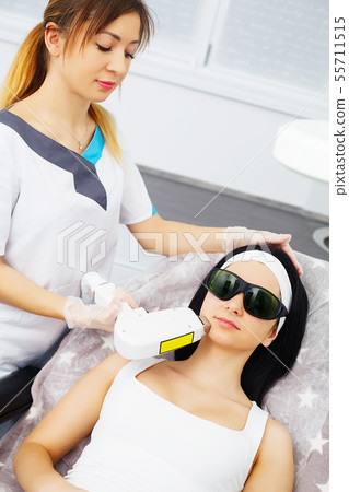 Face Skin Care. Procedure of Microdermabrasion. Mechanical Exfoliation, diamond polishing. Model and Face Skin Care. Procedure of Microdermabrasion. Mechanical Exfoliation, diamond polishing. Model and 55711515