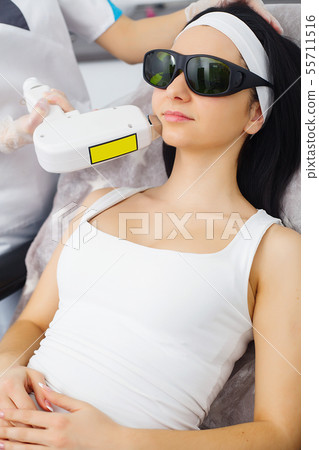 Cosmetology. Procedure of Microdermabrasion. Mechanical Exfoliation, diamond polishing. Model and Cosmetology. Procedure of Microdermabrasion. Mechanical Exfoliation, diamond polishing. Model and 55711516