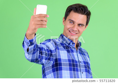 Happy young handsome hipster man taking selfie Happy young handsome hipster man taking selfie 55711820