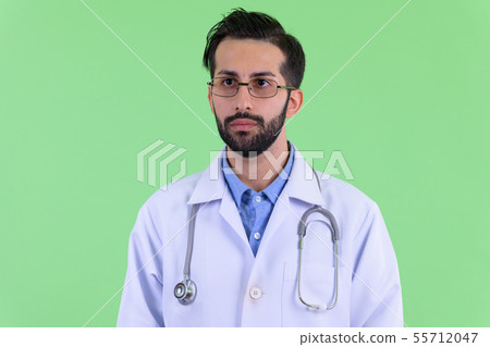 Face of young bearded Persian man doctor thinking 55712047
