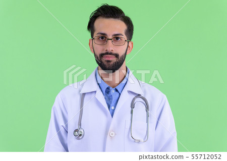 Face of young bearded Persian man doctor 55712052