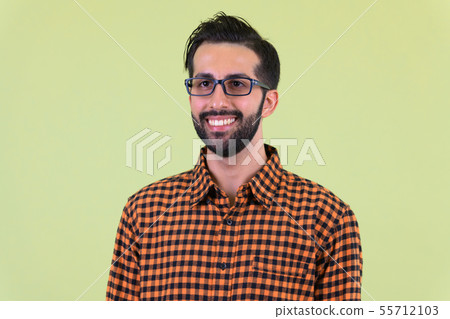 Face of happy young bearded Persian hipster man thinking Face of happy young bearded Persian hipster man thinking 55712103