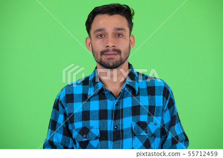 Face of young bearded Persian hipster man 55712459