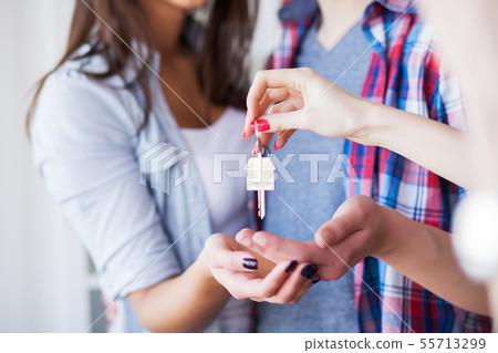 Young happy couple moving into their new home. They unpacking and cleaning new home Young happy couple moving into their new home. They unpacking and cleaning new home 55713299