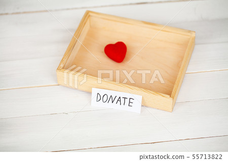 Donations and Charity. Donation Concept. Box of Donations and Heart on the White Background. Donations and Charity. Donation Concept. Box of Donations and Heart on the White Background. 55713822