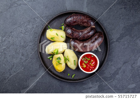 Spanish and Argentine MORCILLA blood sausages with potatoes and chile sauce Spanish and Argentine MORCILLA blood sausages with potatoes and chile sauce 55715727