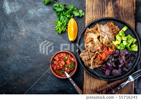 Yucatan Mexican Food Pork POC CHUC poc chuck. Pork marinaded in orange juice served with avocado 55716245