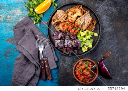 Yucatan Mexican Food Pork POC CHUC poc chuck. Pork marinaded in orange juice served with avocado 55716294