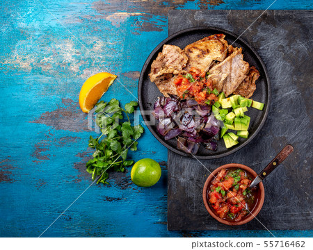 Yucatan Mexican Food Pork POC CHUC poc chuck. Pork marinaded in orange juice served with avocado 55716462