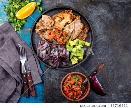 Yucatan Mexican Food Pork POC CHUC poc chuck. Pork marinaded in orange juice served with avocado 55716511