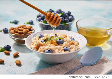 Homemade oatmeal with  fresh blueberry and organic 55716572