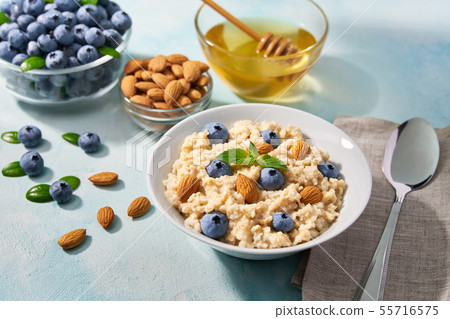 Homemade oatmeal with  fresh blueberry and organic 55716575