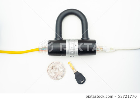 Two computer network cables going through a lock with a key and a crypto currency coin 55721770
