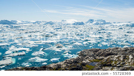 Arctic nature landscape with icebergs in Greenland icefjord - aerial drone image 55728369