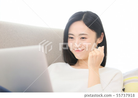 A young lady watching a computer A young lady watching a computer 55737918