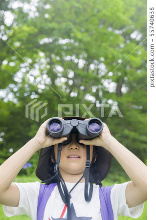 Elementary school girl doing bird watching 55740638