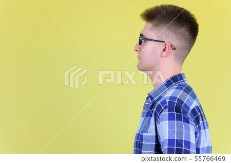 Profile view of young handsome hipster man Profile view of young handsome hipster man 55766469