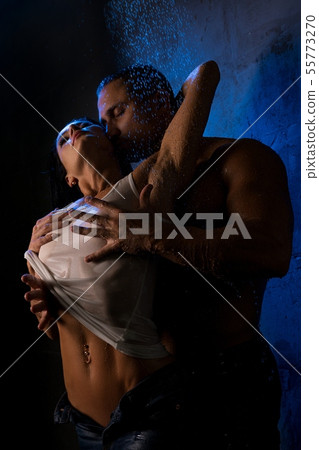Loving couple in steamy embrace in shower view Loving couple in steamy embrace in shower view 55773270