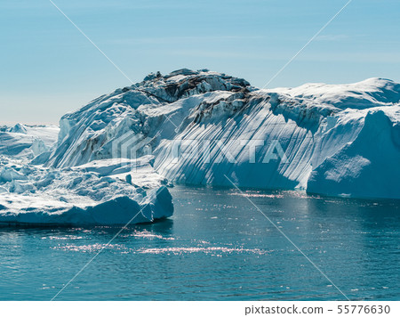 Global Warming and Climate Change - Icebergs from melting glacier on Greenland 55776630