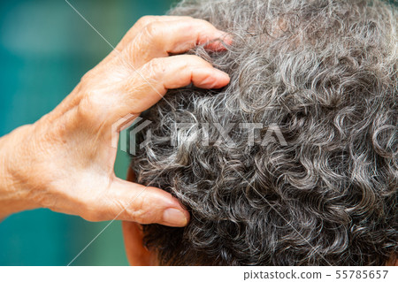 Senior woman scratching back head, Close up& Macro Senior woman scratching back head, Close up& Macro 55785657