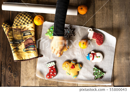 Top view on how a child takes a glazed Christmas Top view on how a child takes a glazed Christmas 55800043