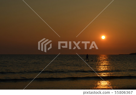 SUP on the sea at dusk SUP on the sea at dusk 55806367