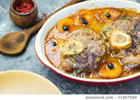 Meat cooked in apricot sauce Meat cooked in apricot sauce 55807889